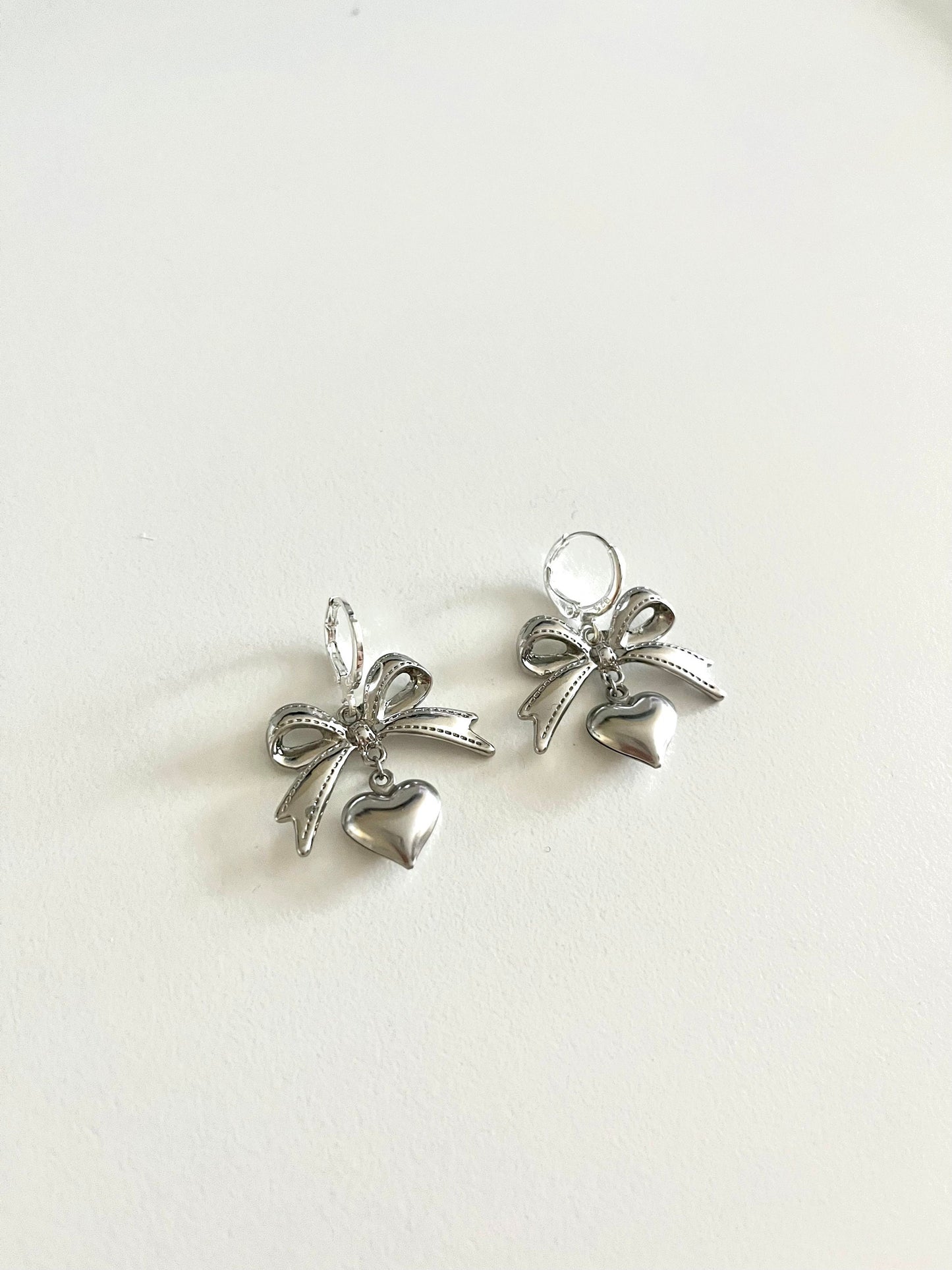 SILVER COQUETTE EARRING